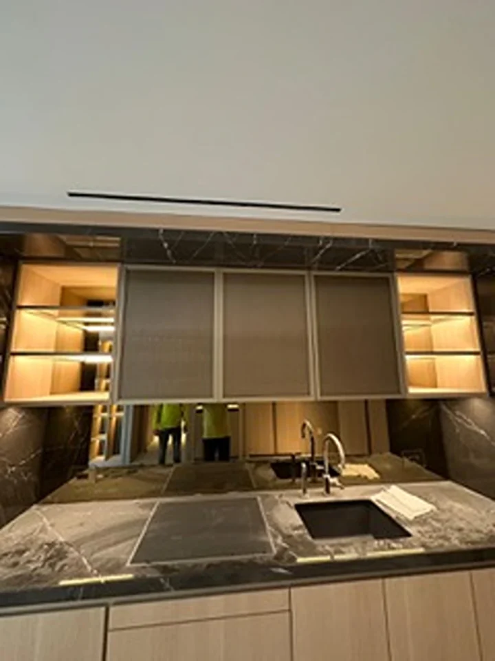 a kitchen with a sink and cabinets