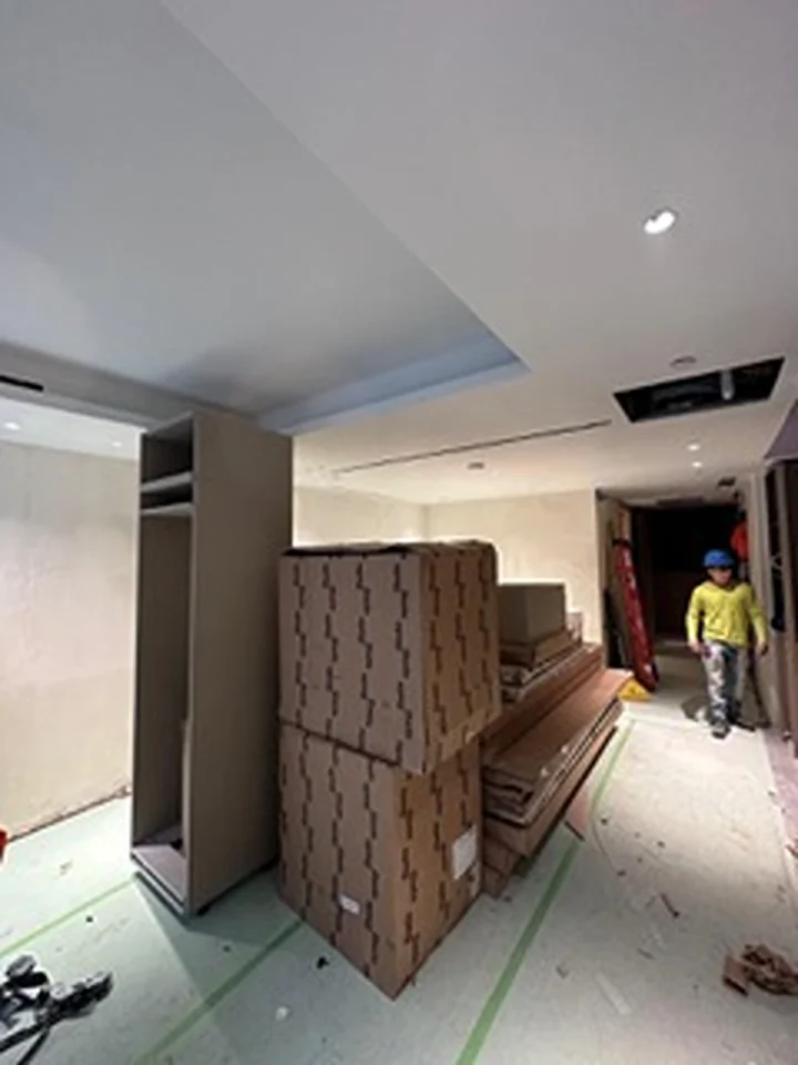 a person standing in a room with boxes