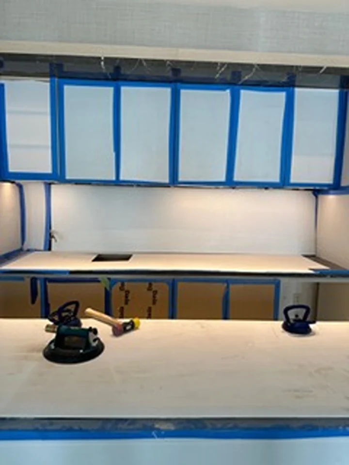 a white counter with blue trim