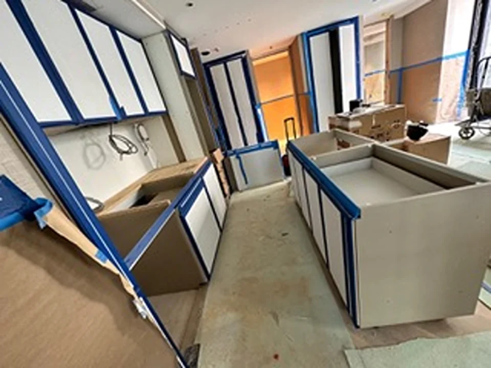 a room with cabinets and boxes