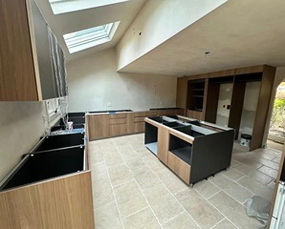 a kitchen with a skylight