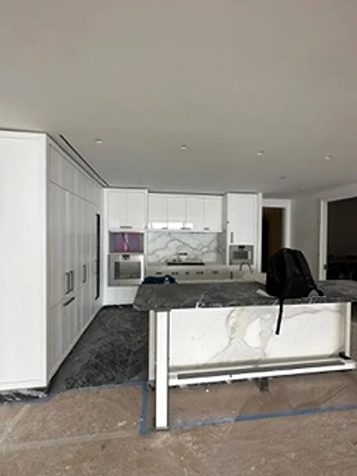 a kitchen with a marble countertop