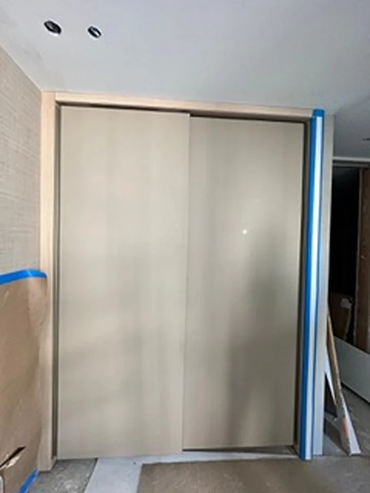 a closet doors with blue tape