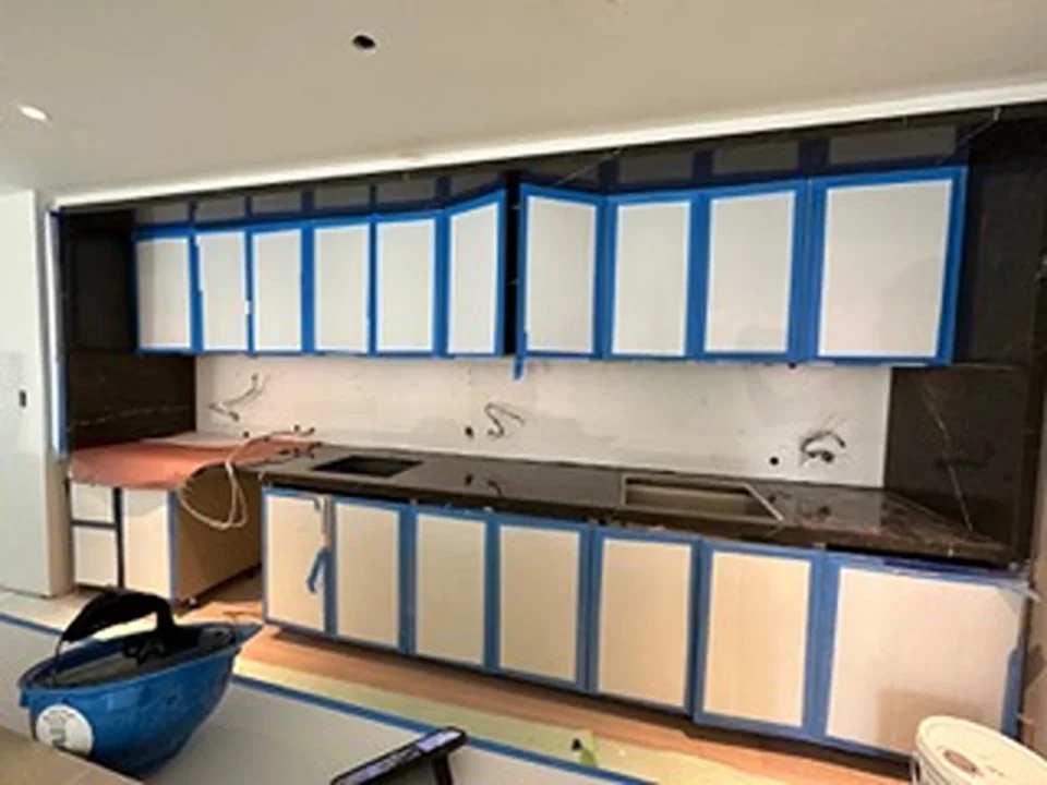 a kitchen with blue and white cabinets