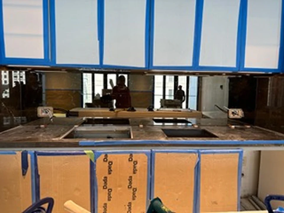 a kitchen with blue and white cabinets