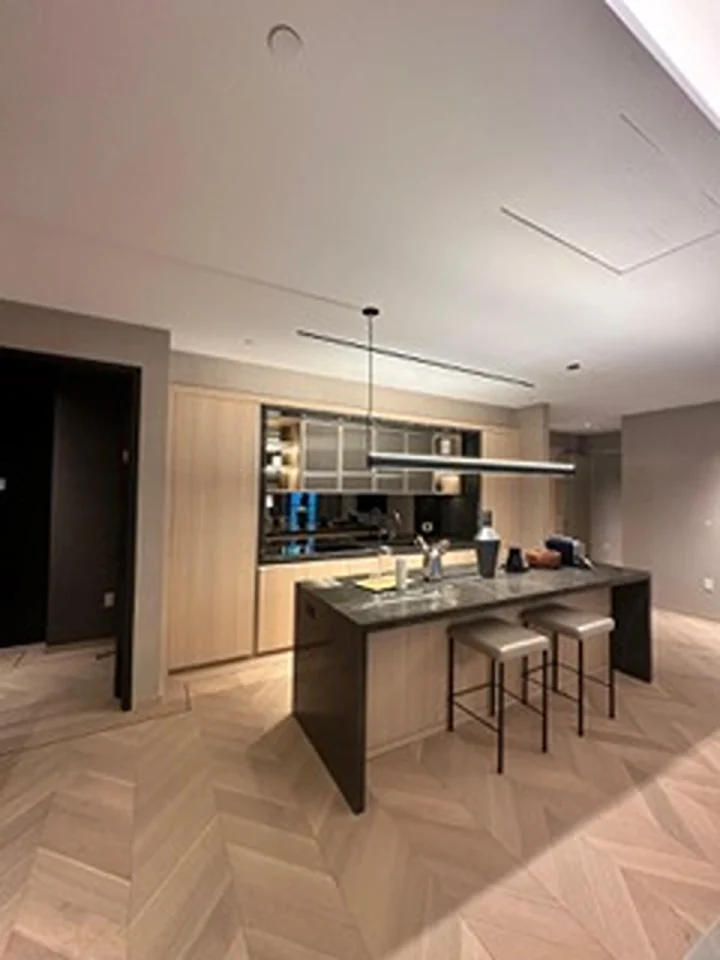 a kitchen with a bar and stools