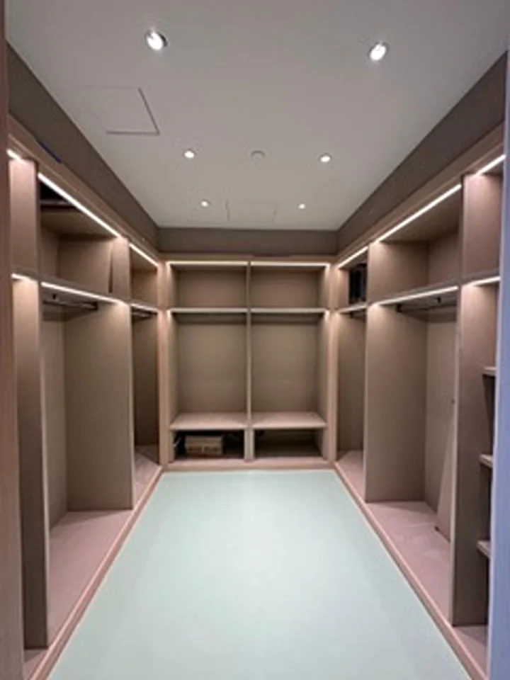 a large closet with lights