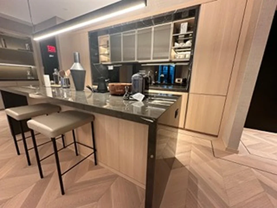 a kitchen with a bar and stools