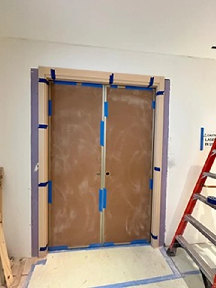 a door with blue tape around it