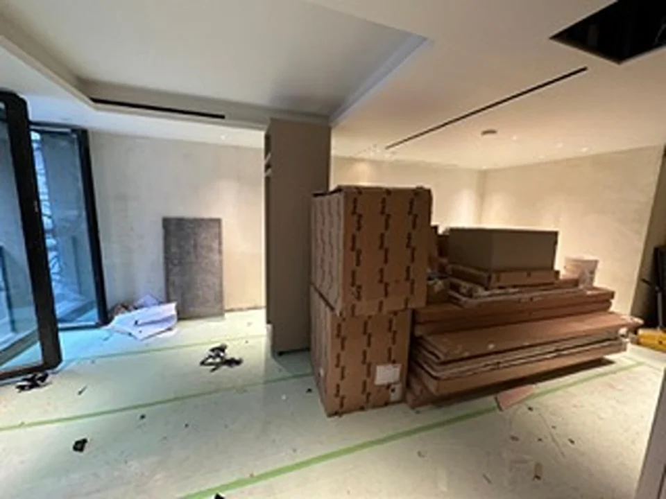 a room with cardboard boxes and a window