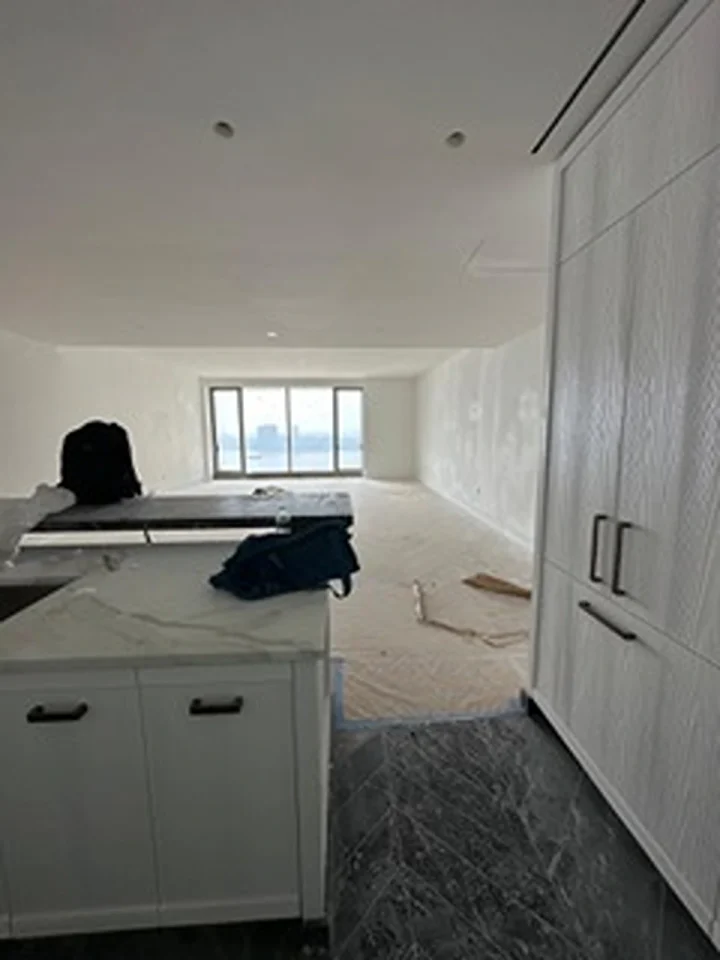 a room with a kitchen and a sink