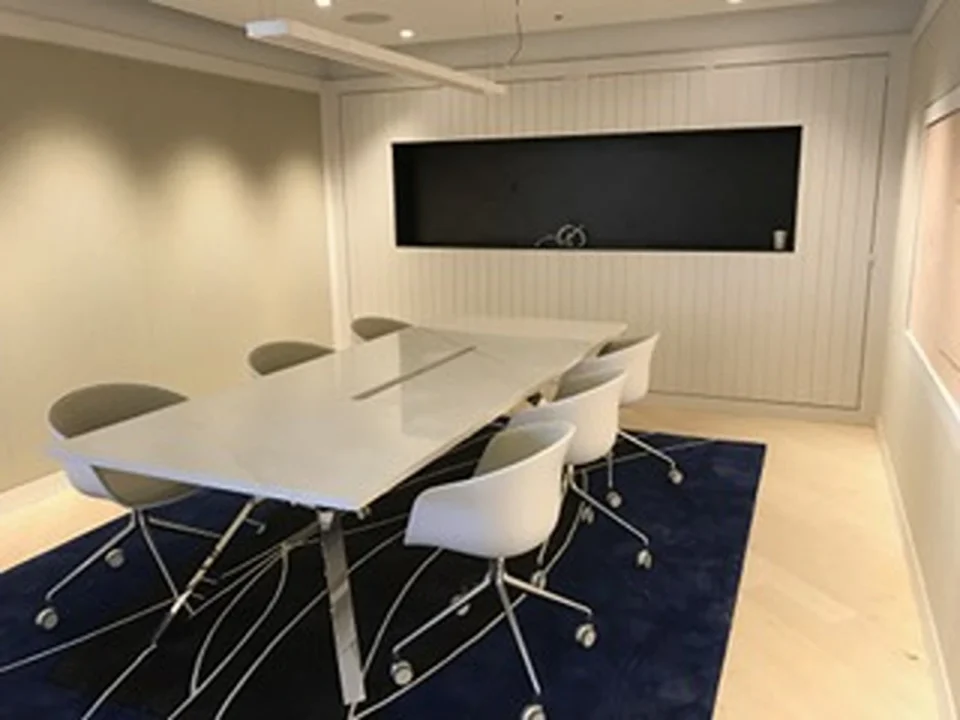 a white table and chairs in a room