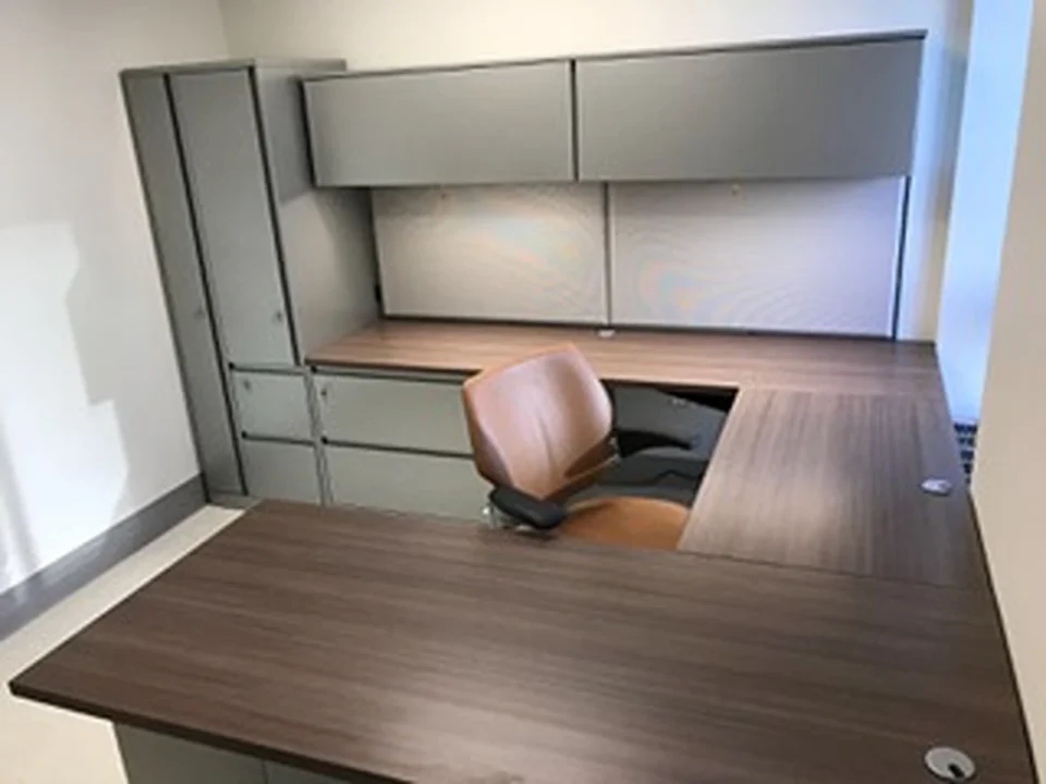 a desk with a chair in it