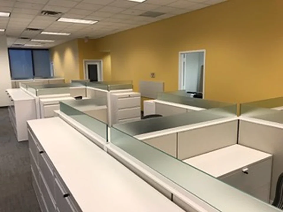 an office cubicles with glass panels