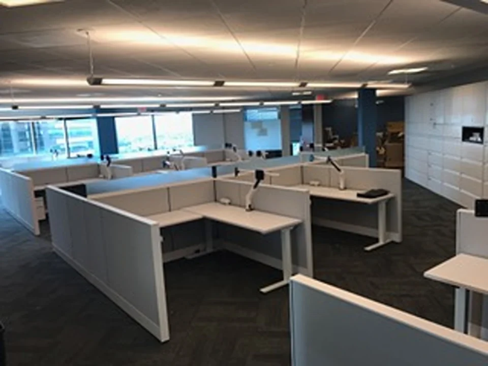 an office cubicles with desks and chairs