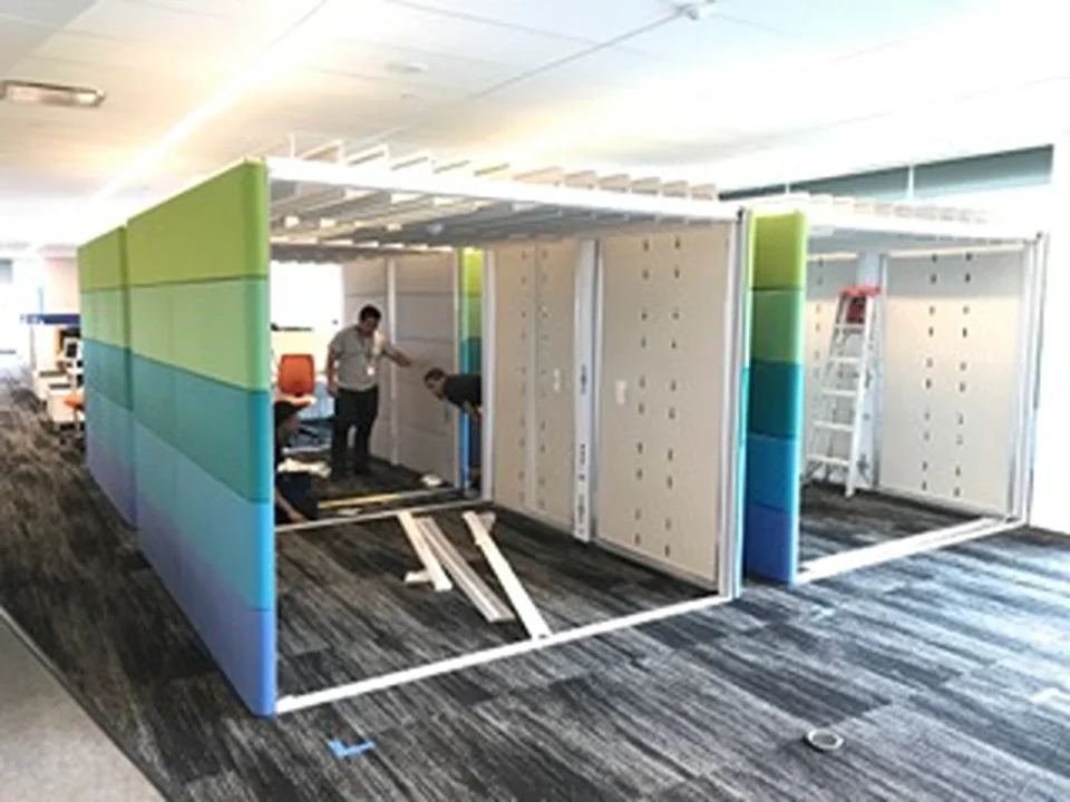 a group of people working in a room