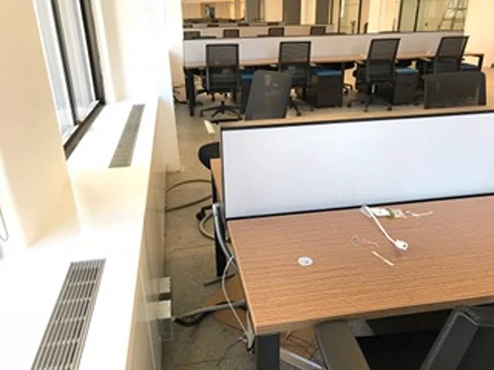 a desks and chairs in an office