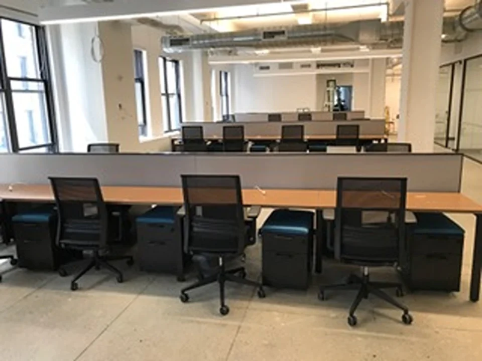 a room with chairs and desks