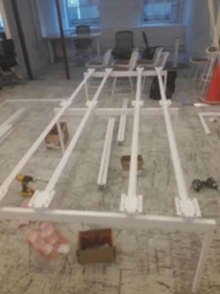 a white frame on the floor