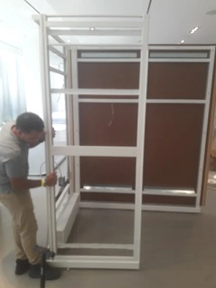 a man holding a white frame