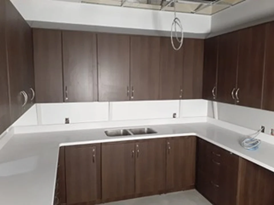 a kitchen with brown cabinets