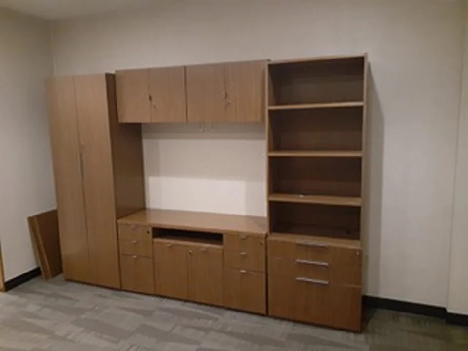 a room with a cabinet and shelves