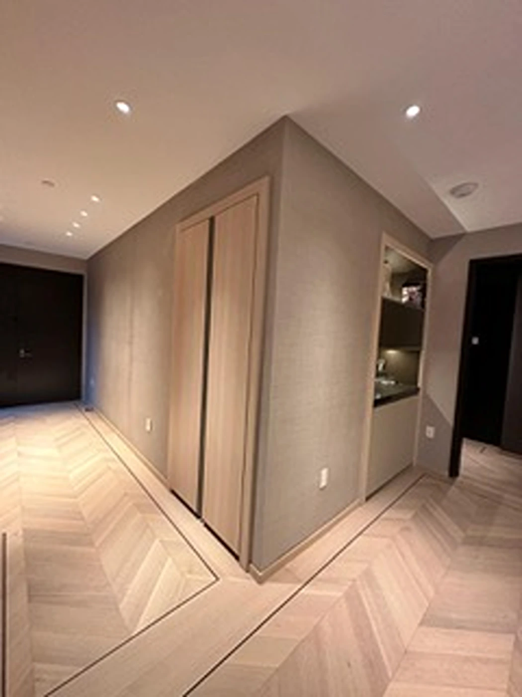 a room with a closet and a wood floor