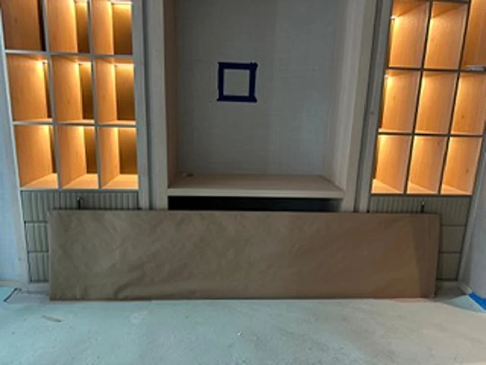 a room with shelves and a wall