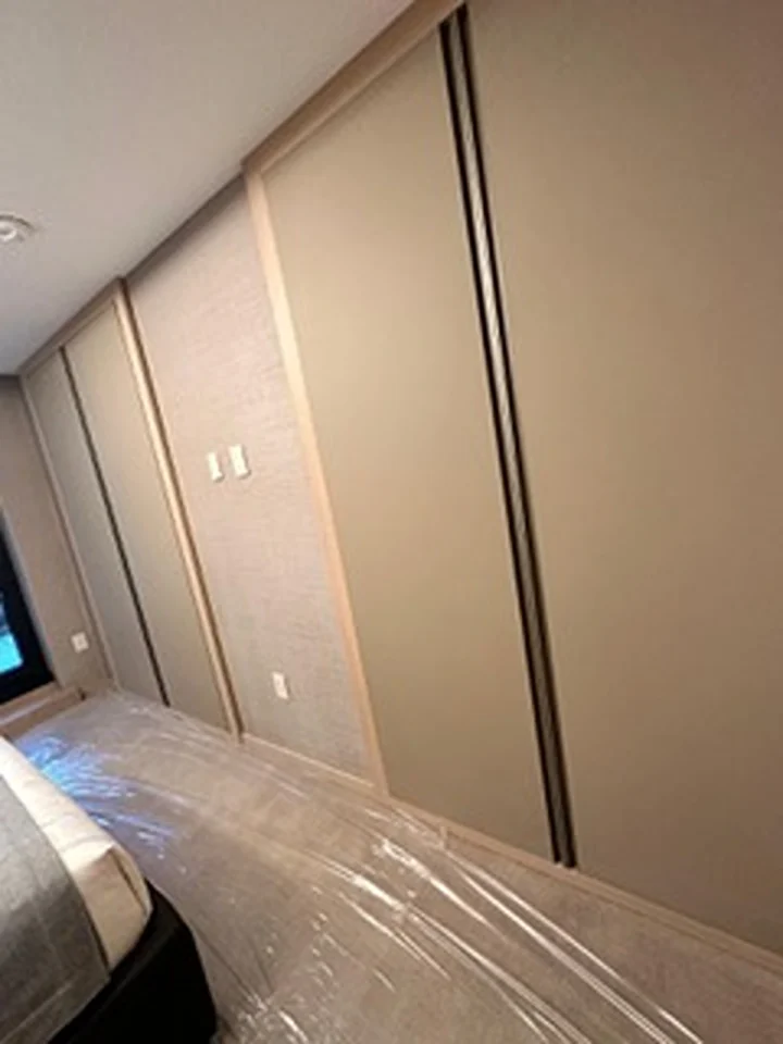 a room with a door and a bed