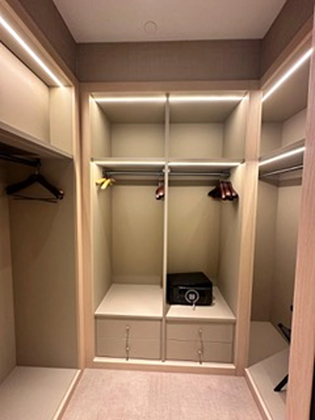 a closet with shelves and lights