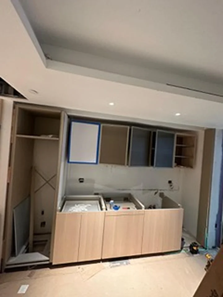 a kitchen with cabinets and a ceiling