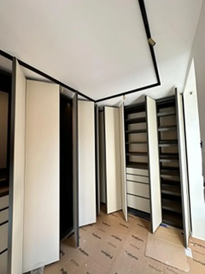 a room with shelves and lights