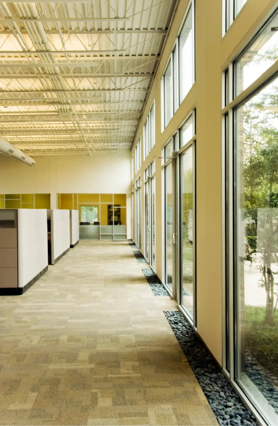 a room with glass walls and a wall of windows